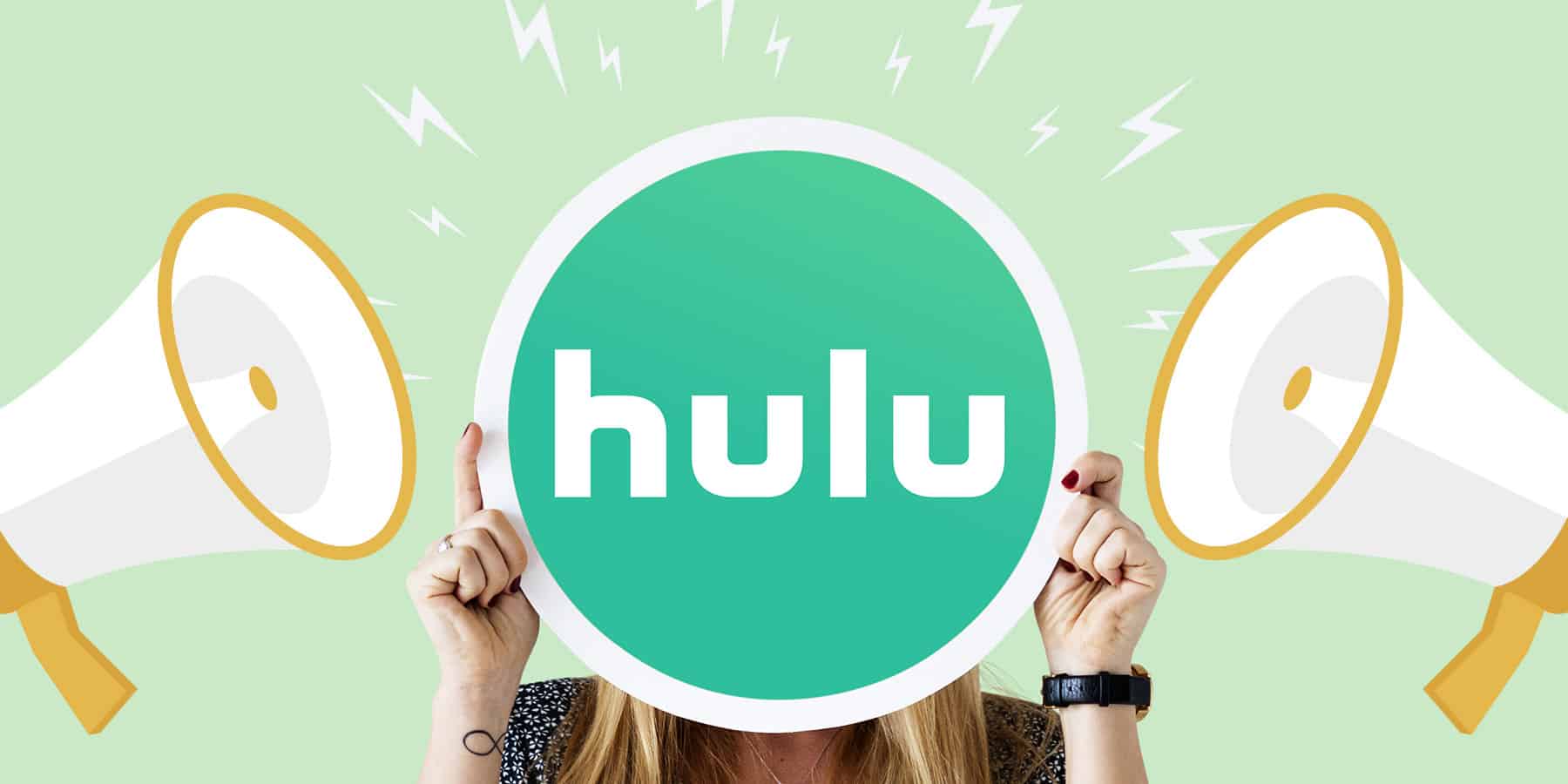 A woman holding the Hulu logo with two megaphones on either side